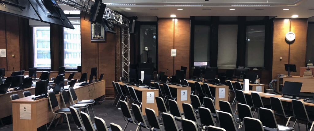 Secure public inquiry meeting room with AV setup